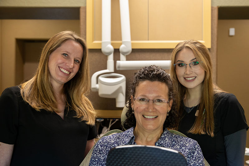 patient and doctor smiling after patient's dental procedure