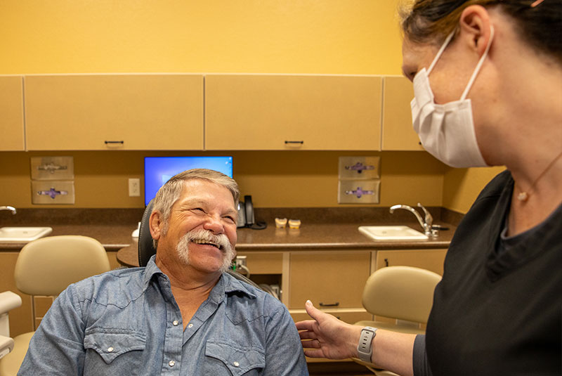 patient and doctor going over dental procedure information