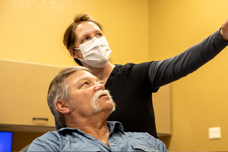 patient and doctor going over dental procedure information
