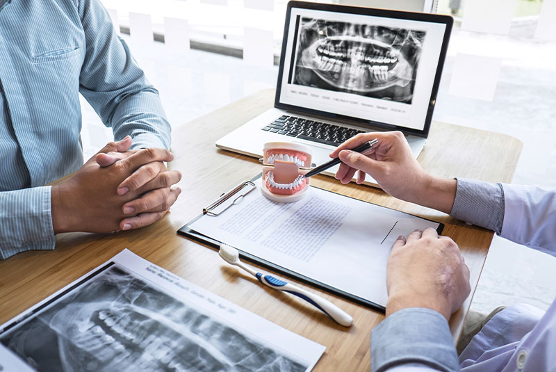 patient and doctor going over dental consultation