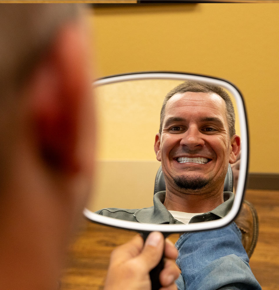 patient smiling confidential after their dental procedure