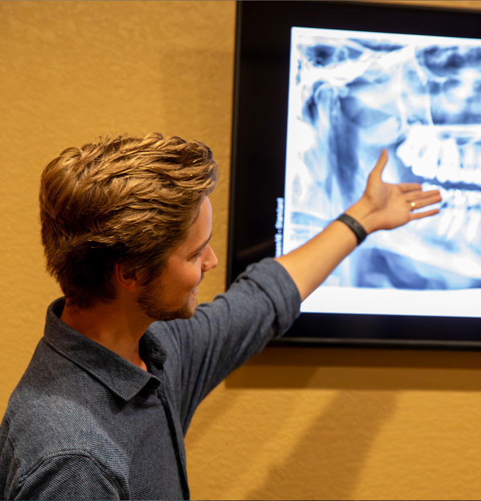 staff member going over dental procedure information within the dental practice