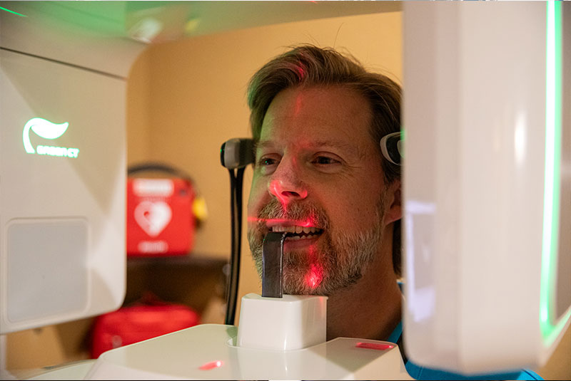 patient undegoing digital x-ray scan for dental procedure